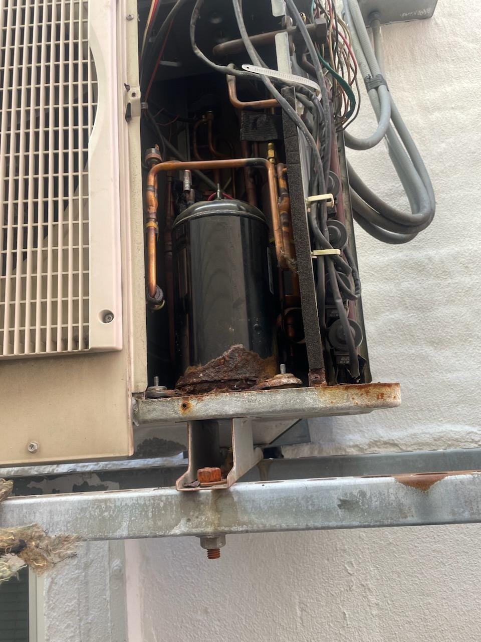 Failed AC compressor with refrigerant oil leak and heavy corrosion